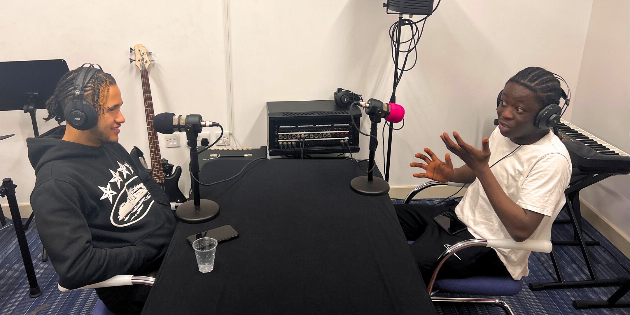 One of our young people is speaking enthusiastically to Newham-raised grime artist Swanandonly during their recording session for the Newham Dictionary of Culture podcast 